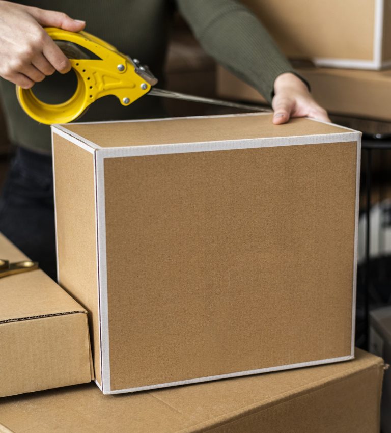 Small business owner packing product parcel boxes for delivery Small business owner packing product parcel boxes for delivery